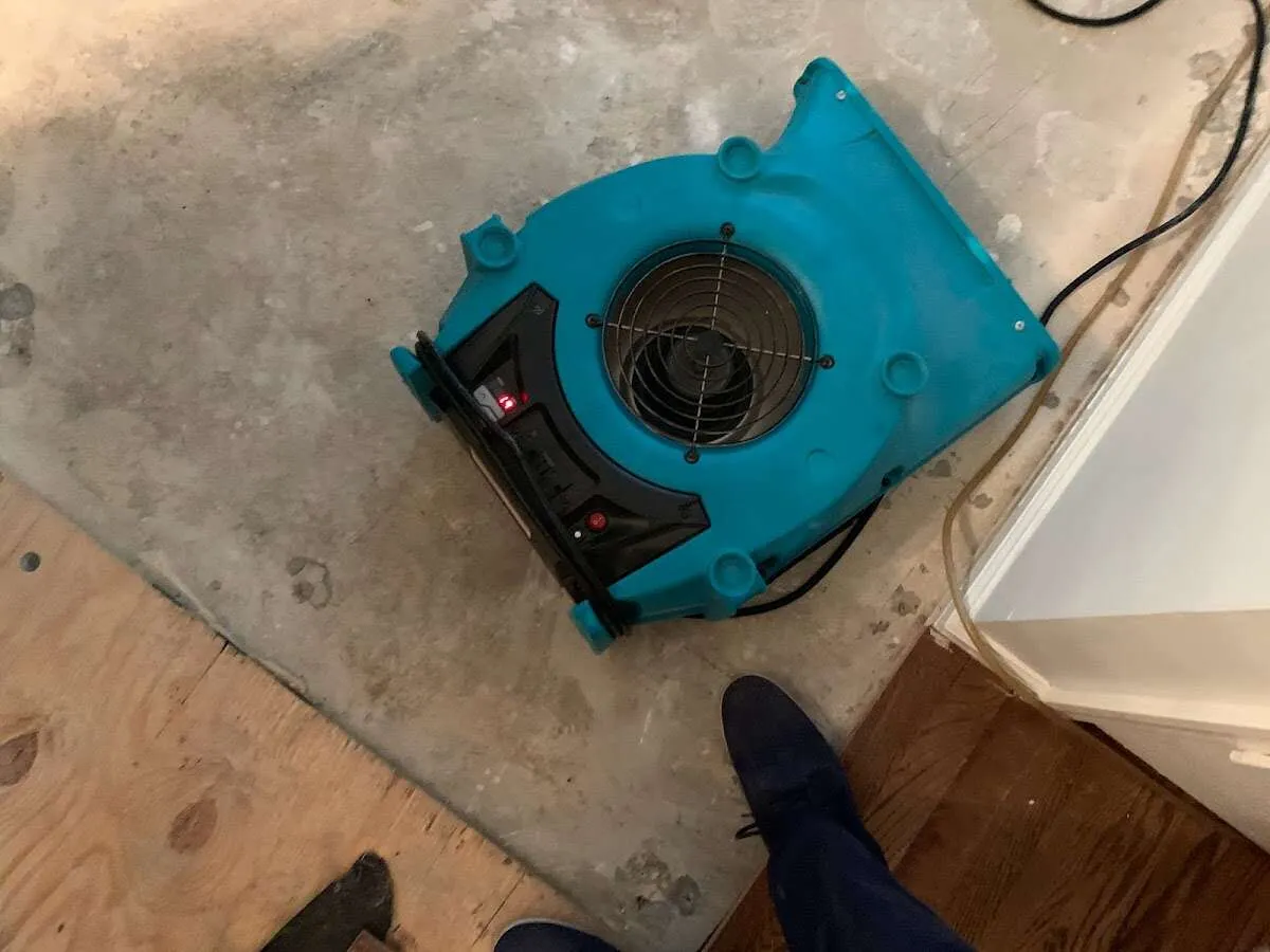Air mover drying subfloor during Commercial Water Damage Restoration in Chicago Ridge